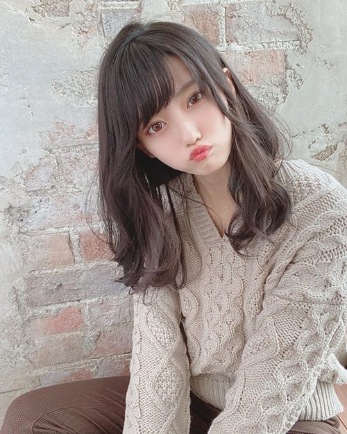 Extremely cute and doll-like when posing