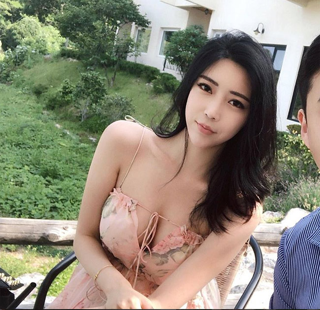 Her quite stiff, expressionless face and stunningly beautiful body are considered 'normal in Korea' because cosmetic surgery is so common and easy.
