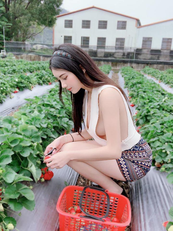 The girl wears a loose top that reveals her upper body with smooth, fair skin.