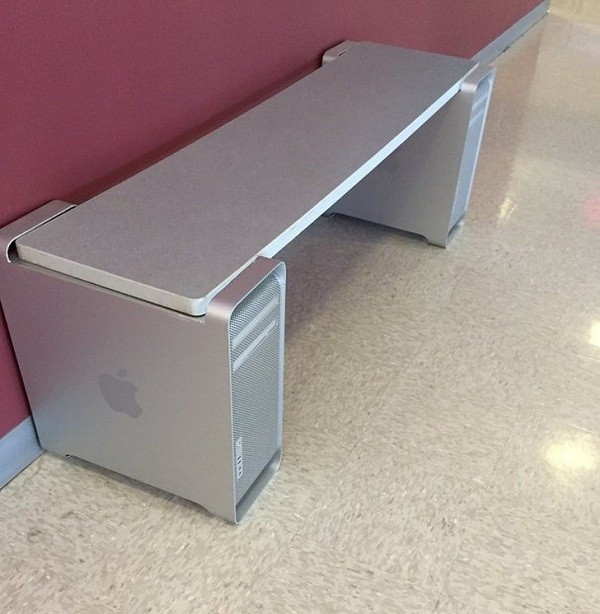 Two stylish Mac Pro boxes used as table legs.