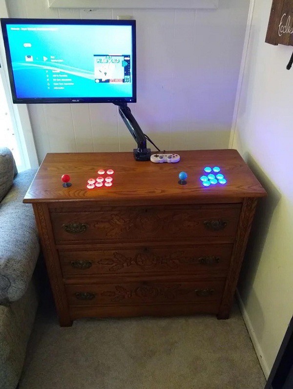 A gaming button with a blinking light securely installed right on the surface of a cabinet.
