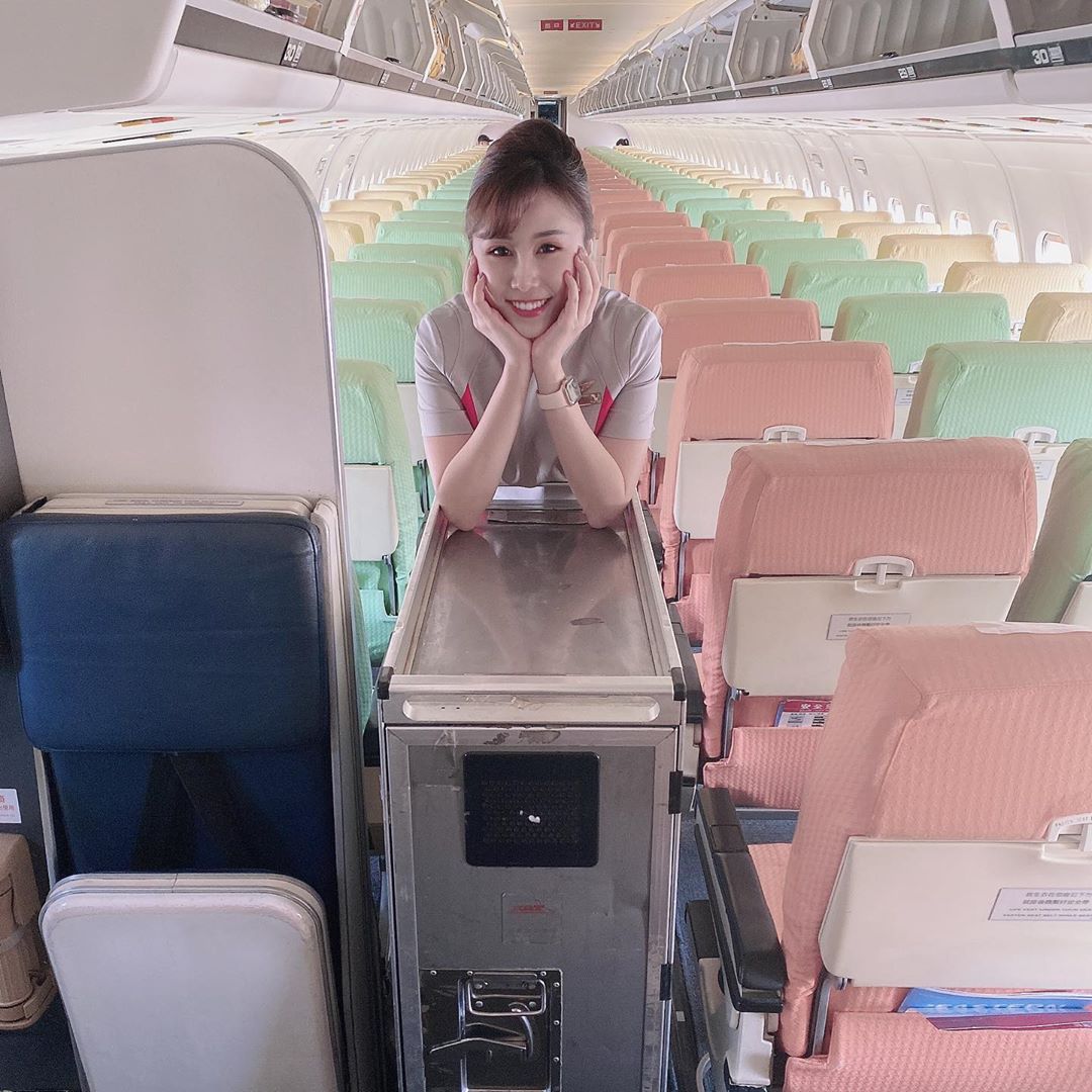 The beautiful flight attendant with a radiant smile