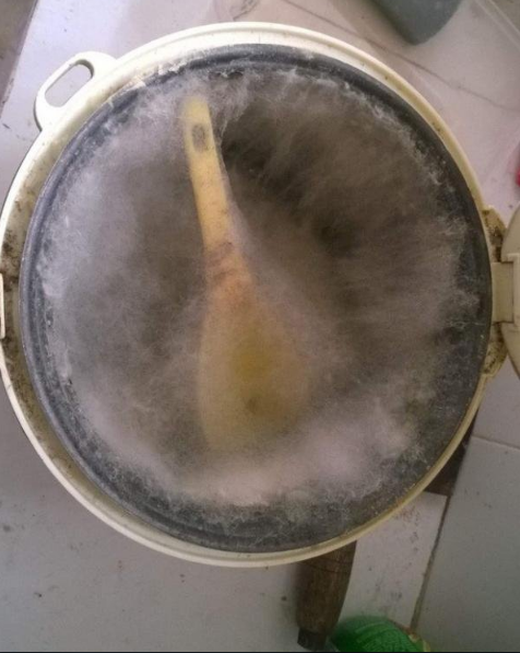 Cooking utensils covered in dust.
