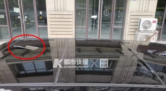 The woman threw a meat cleaver at her boyfriend but missed, causing it to fall onto the expensive car parked below.