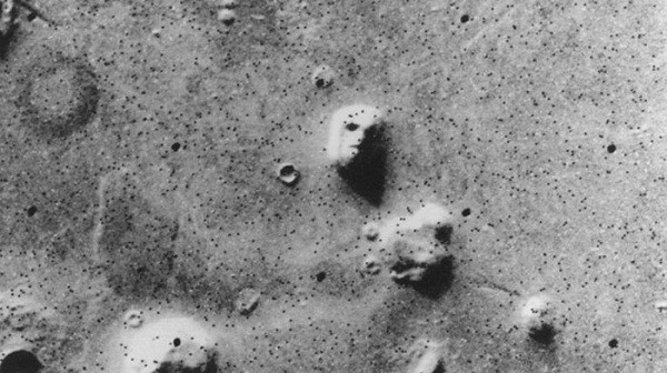 NASA's Viking 1 spacecraft captured a rather bizarre image described as a large rock formation resembling a human head; in the shadows, the features of this 'face' become more pronounced, reigniting discussions about Martian civilization.