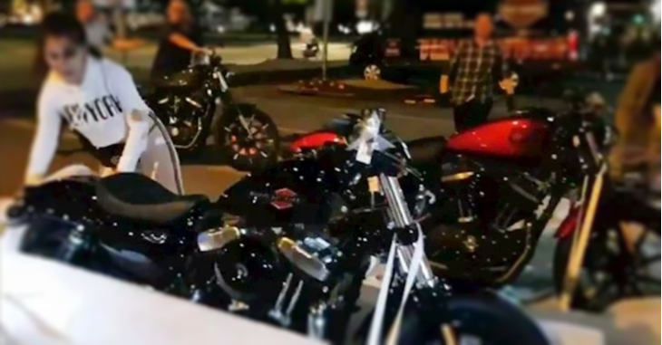 The wife accompanied her husband to the showroom to choose the bike.