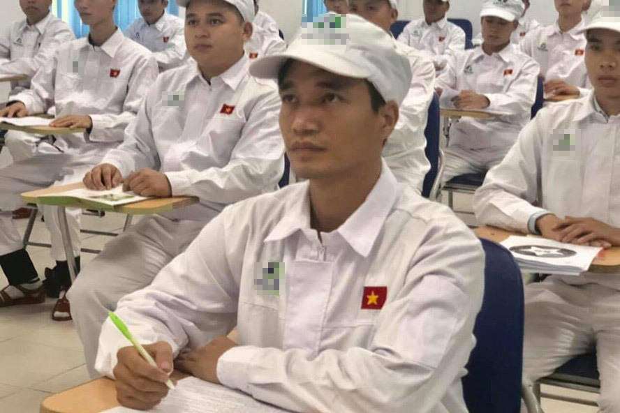 Image of him returning to work as a factory worker