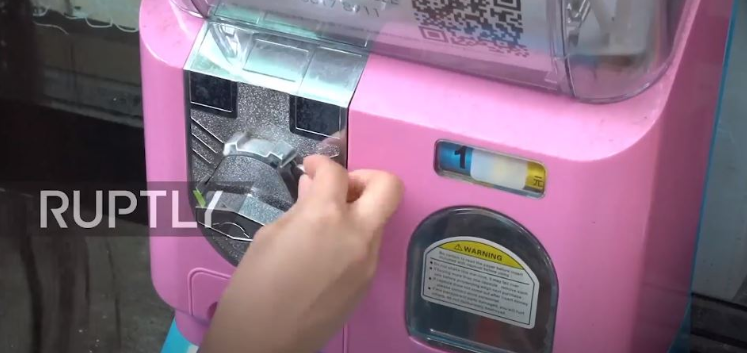Users insert coins into the machine to obtain information.