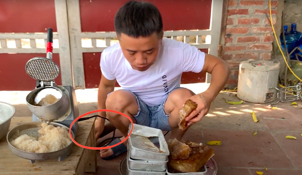 Hau Troll carelessly places the pestle on the ground before using it again