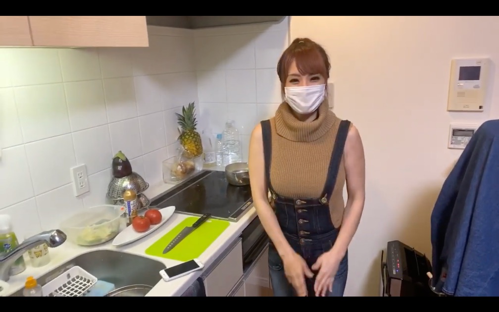 The YouTuber starts the video in a modest yet form-fitting outfit that reveals her alluring curves