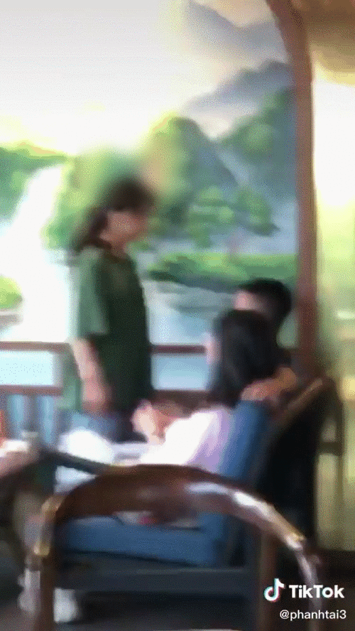 Young man being slapped repeatedly by the girl without resistance - Clip still image