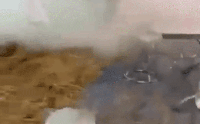 Image of the wedding tent filled with smoke and guests fleeing
