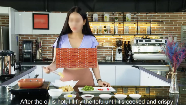 Although it is a cooking tutorial, this girl is dressed in a very inappropriate manner
