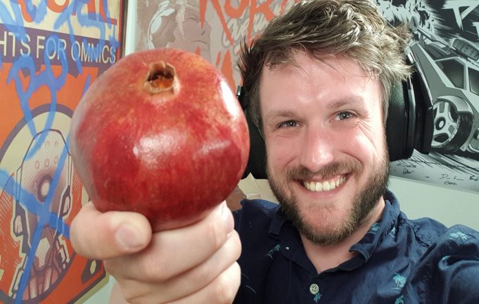 Portrait of Rudeism, the YouTuber who turned a pomegranate into a game controller