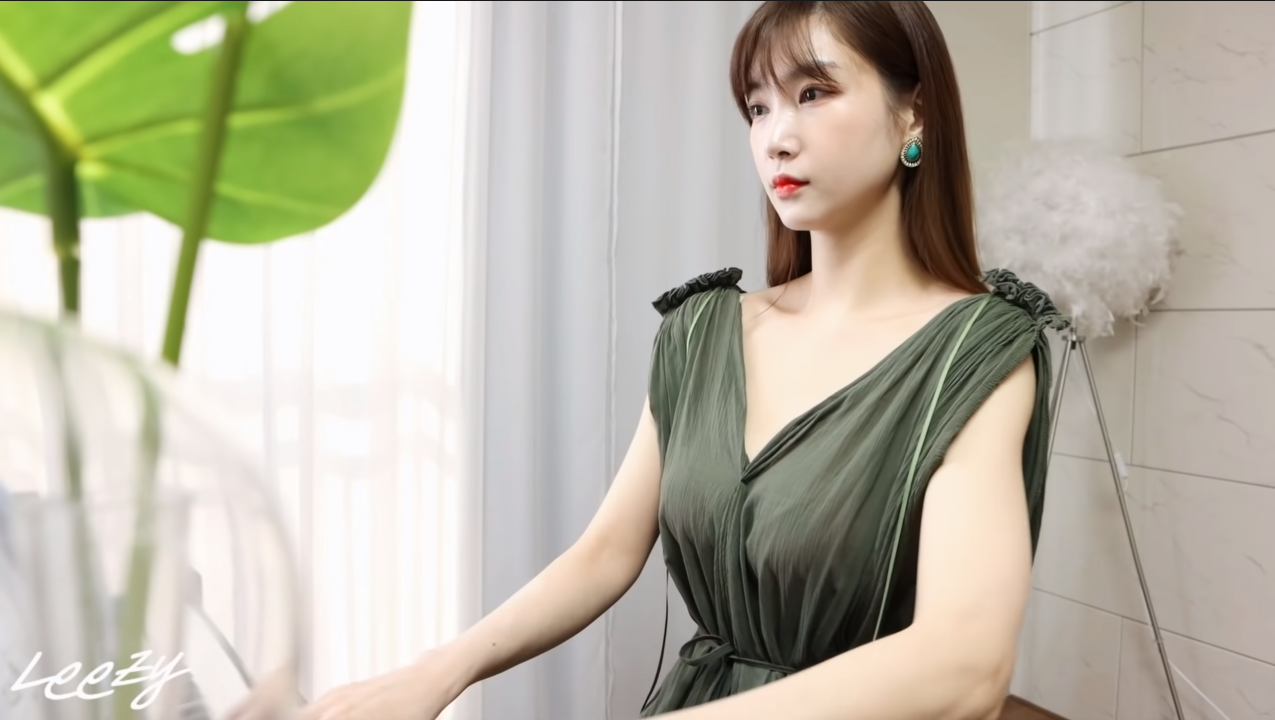 Initially, Leezy was fully dressed to play the piano