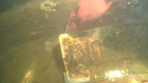 The group accidentally discovered a mysterious car submerged in debris while cleaning the lakebed