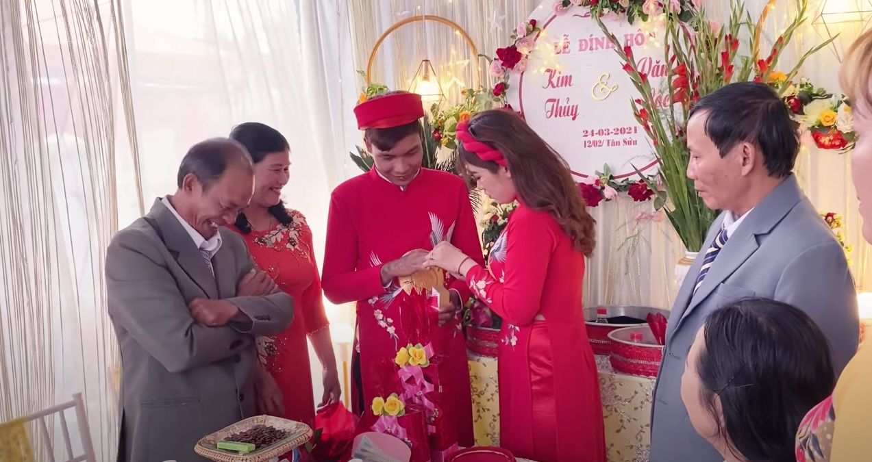 Parents from both sides witnessing the couple exchanging rings