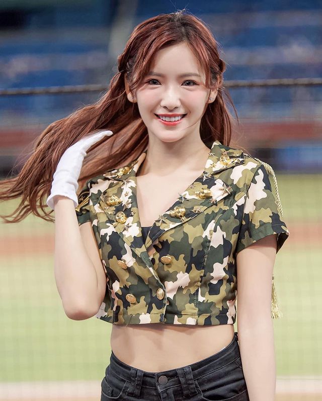 Alongside her familiar cheerleading job