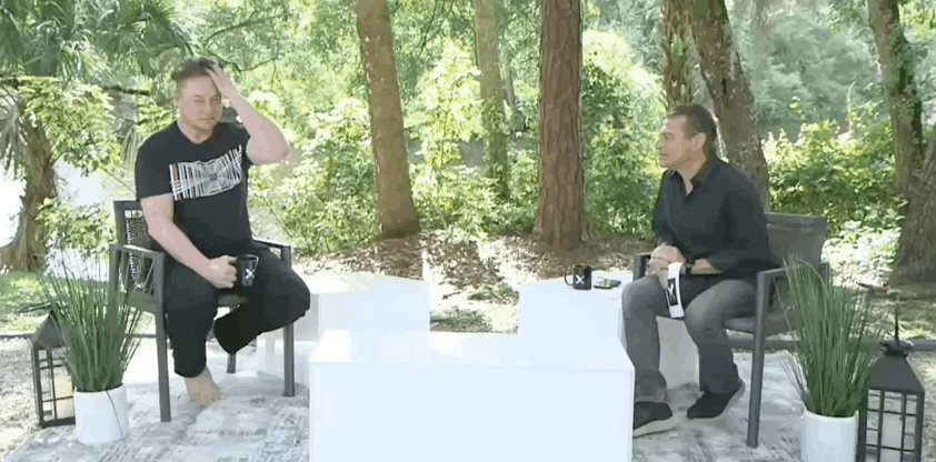 Elon Musk goes barefoot while discussing plans with Peter Diamandis about returning to the moon.