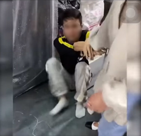 He even clung tightly to his mother's hand as if he wasn't ready for a 'new experience'