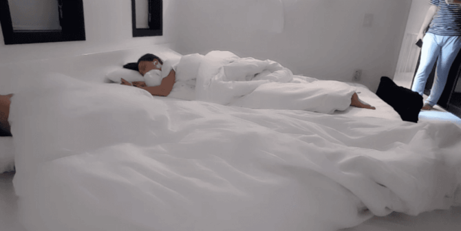 A man unexpectedly appears while Geung-jeong is still deep asleep