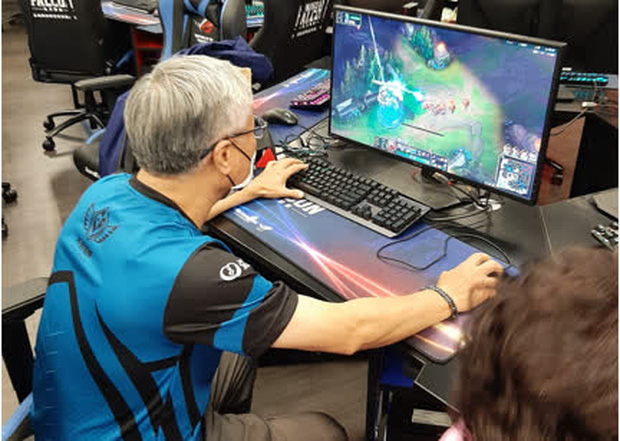 An elderly man with white hair is moving to defend a turret, surprising many people