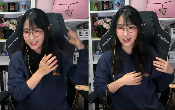 The streamer still smiling after the incident, even showing off her slightly singed hair
