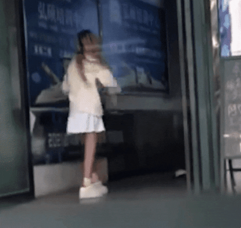 The young man was probably shocked by his girlfriend's actions right outside the internet cafe