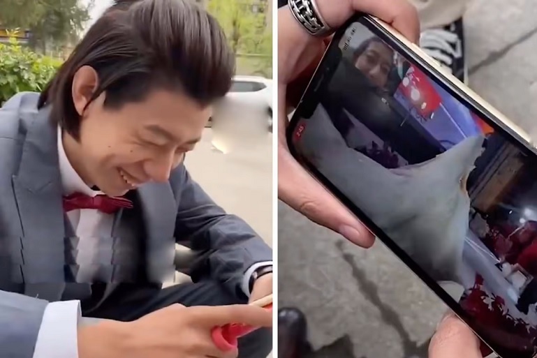 Image of the groom watching the livestream of his own wedding causing a stir among netizens