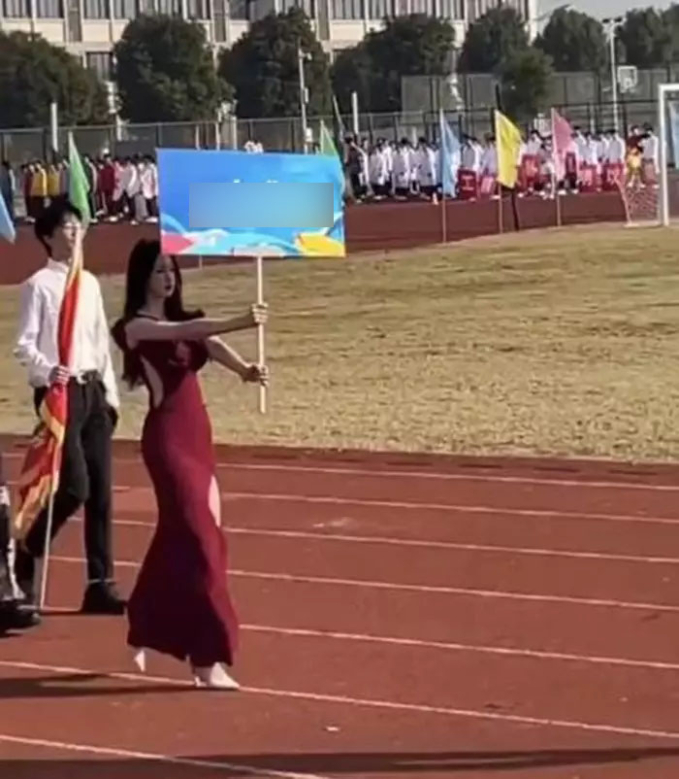 Just Holding Parade Banners, Two Female Students Spark Online Buzz with Their Stunning Looks 1 A moment that caught attention.