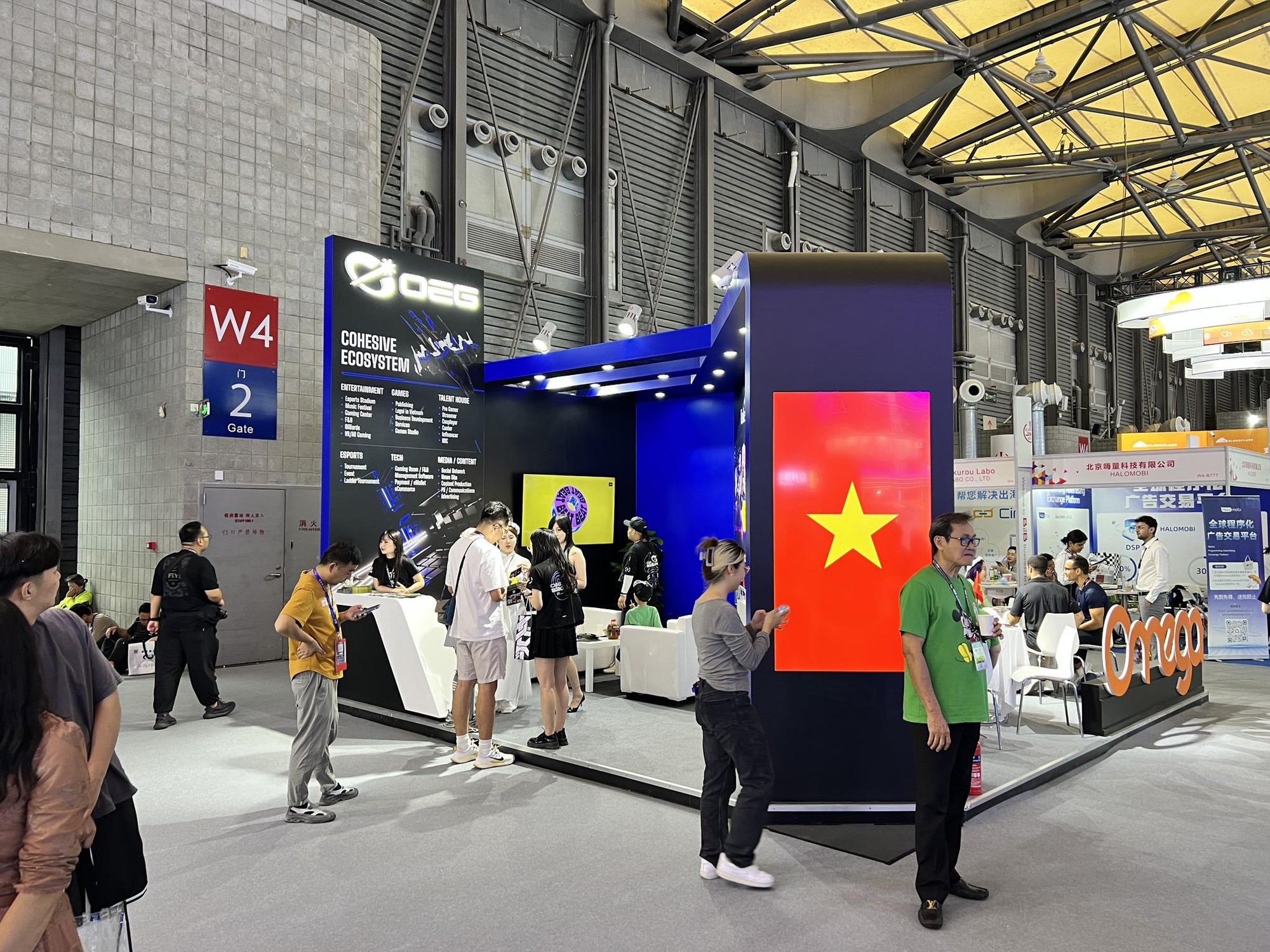OEG - What Does the Vietnamese eSports Unit Bring to Asia's Largest Technology Exhibition, ChinaJoy 2024? 1 OEG's booth, predominantly featuring blue tones, is located in the B2B area - Hall W4 - B710, attracting hundreds of partner visits each day.