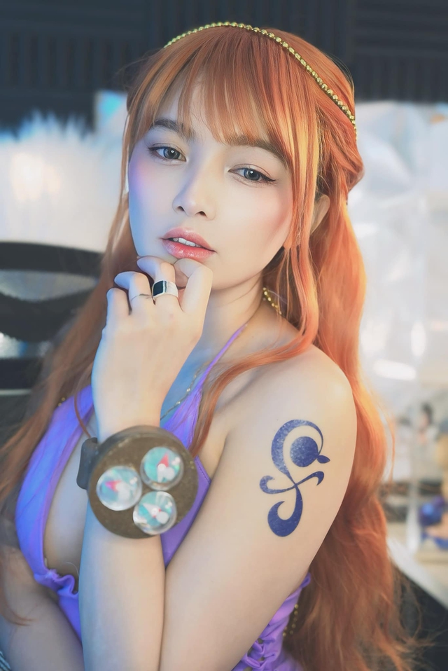 Stunning Hot Girl Showcases Nami Cosplay, Flawless and Alluring 4 47683502211995768681990254311341141390527292n 17396050277721627438661